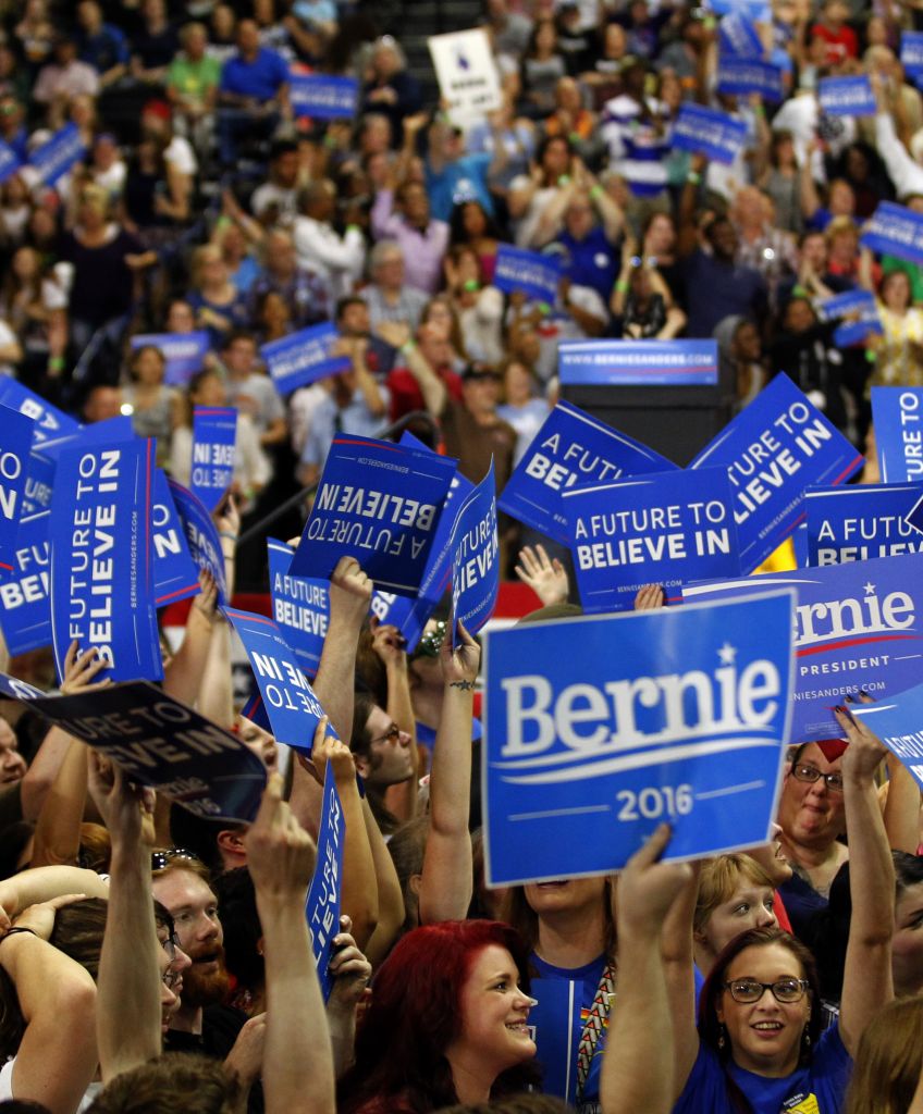 Bernie Sanders campaign supports cheer for their candidate as they wait for his arrival at the Big Sandy Superstore Arena for a campaign rally on April 26, 2016 in Huntington, West Virginia. (Photo by John Sommers II/Getty Images)