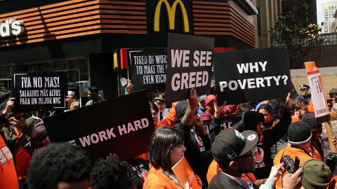 Low-wage workers, many in the fast-food industry, join with supporters in front of a New York City McDonald's to demand a minimum wage of $15 an hour. Home care workers, and employees at Walmart and fast food restaurants say that the current minimum is not a living wage. (Photo by Spencer Platt/Getty Images)