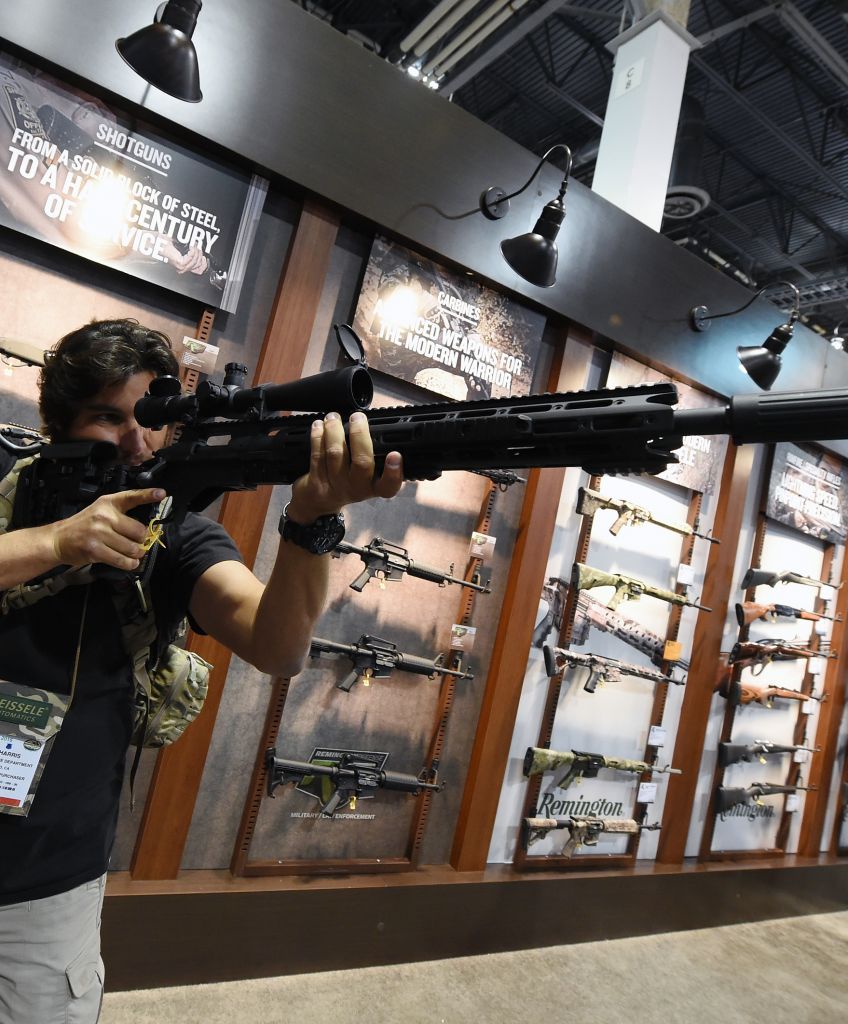 Billy Harris tries out a rifle at the Remington booth at the 2016 National Shooting Sports Foundation's Shooting, Hunting, Outdoor Trade (SHOT) Show on Jan. 19, 2016 in Las Vegas, Nevada. (Photo by Ethan Miller/Getty Images)