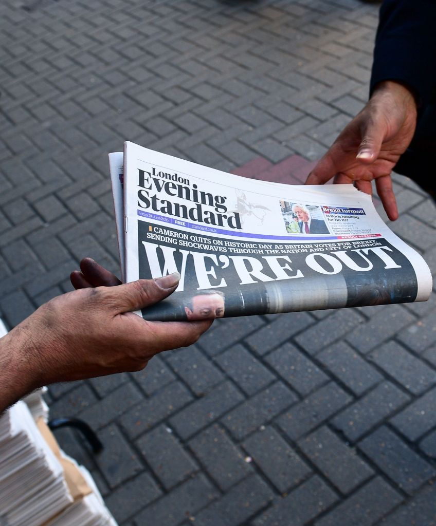 A man takes a copy of the London Evening Standard with the front page reporting the resignation of British Prime Minister David Cameron and the vote to leave the EU in a referendum. (LEON NEAL/AFP/Getty Images)