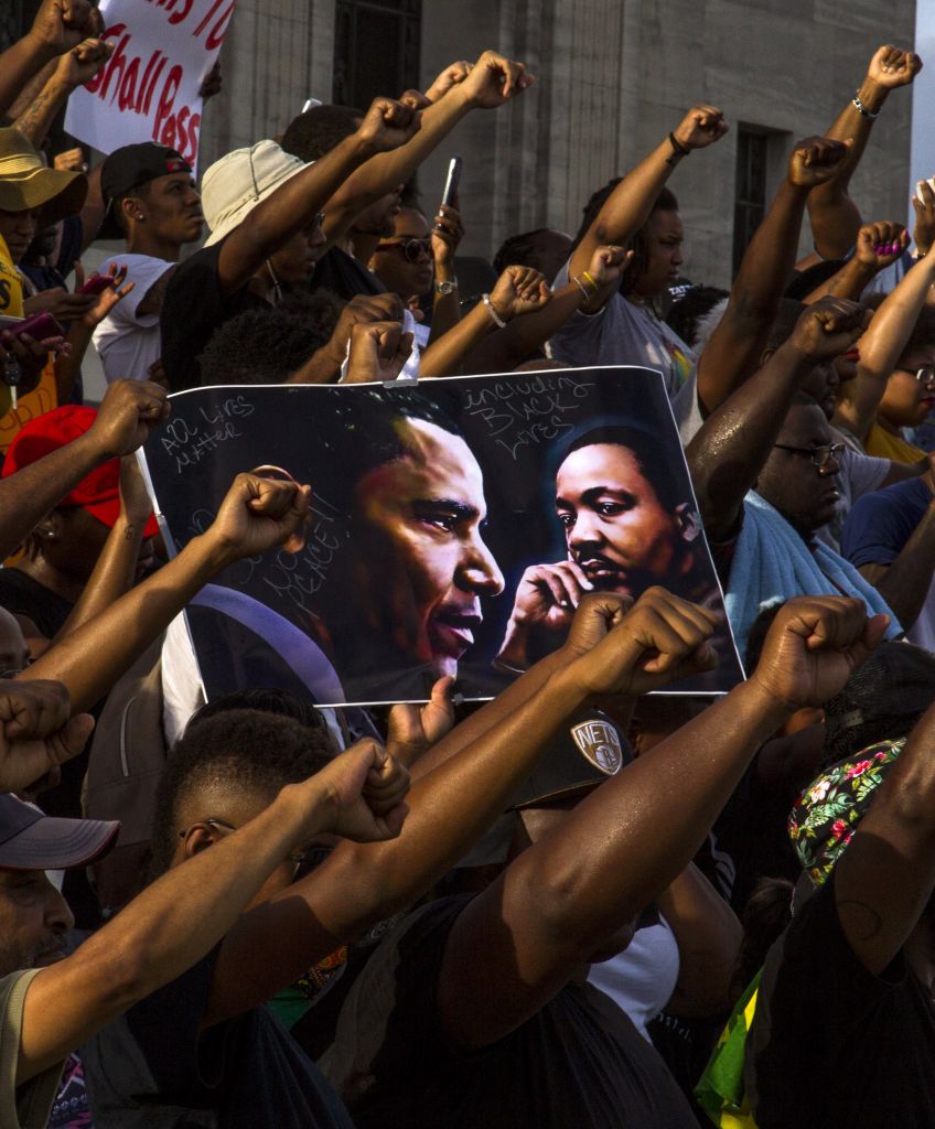 Demonstrators gather after marching at the Louisiana Capitol to protest the shooting of Alton Sterling on July 9, 2016 in Baton Rouge, Louisiana. (Photo by Mark Wallheiser/Getty Images)