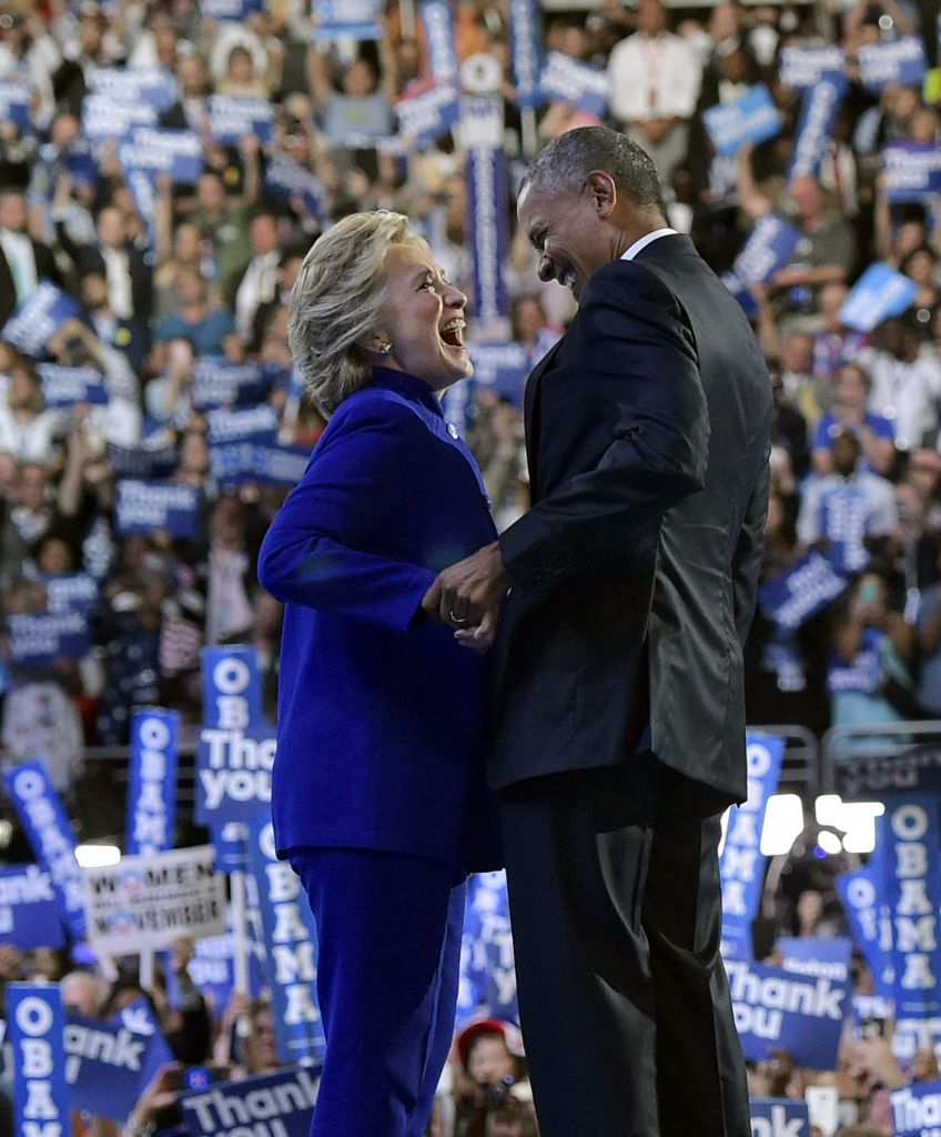 President Barack Obama is joined by Democratic presidential candidate Hillary Clinton after his address to the Democratic National Convention in Philadelphia, Pennsylvania, July 27, 2016. (MANDEL NGAN/AFP/Getty Images)