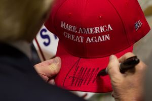 Trump signs "Make America Great Again" cap