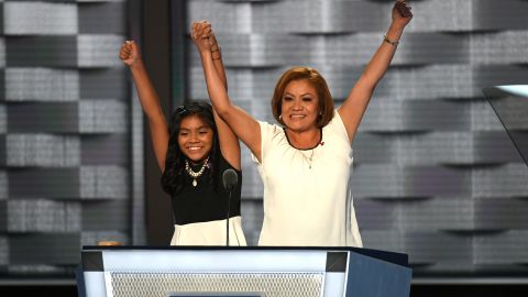 Karla Ortiz, 11, with her mother, Francisca Ortiz, at the podium of the Democratic National Convention, was one of many Hispanic speakers to address the gathering in Philadelphia. (Photo by Toni L. Sandys/The Washington Post via Getty Images)