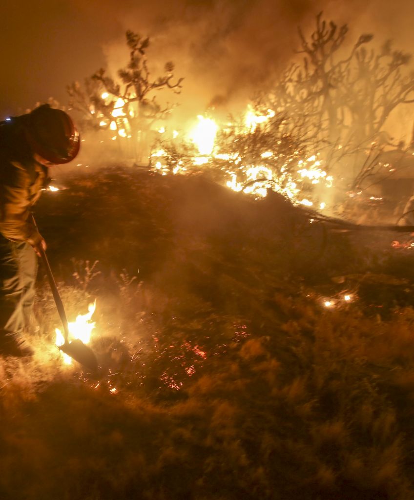 A firefighter battles the Blue Cut wildfire near Cajon Pass, north of San Bernardino, California on August 16, 2016. (RINGO CHIU/AFP/Getty Images)