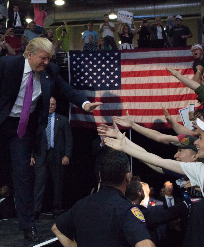 Donald Trump arrives at a campaign rally last night in Everett, Washington. Trump addressed immigration issues as his campaign confirmed an August 31 meeting with Mexico's President Enrique Peña Nieto. (Photo by Matt Mills McKnight/Getty Images)