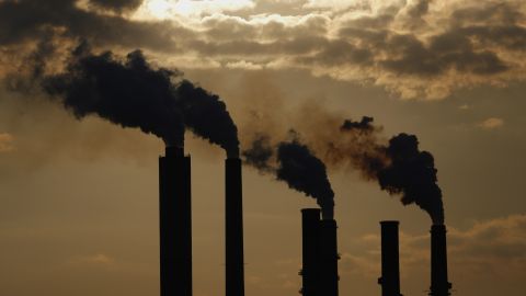 The silhouettes of emissions are seen rising from stacks of the Duke Energy Corp. Gibson Station power plant at dusk in Owensville, Indiana, U.S., on Thursday, July 23, 2015. (Luke Sharrett/Bloomberg via Getty Images)