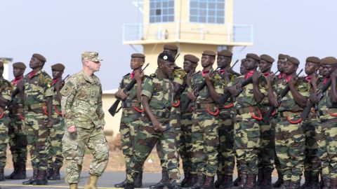 US Army Brigadier Gen. Donald Bolduc (left) and Senegal's Army Gen. Amadou Kane review the troops during the inauguration of a military base in Thies, 70 km from Dakar, on Feb. 8, 2016, the second day of a three-week joint military exercise between African, US and European troops, known as Flintlock. (Photo by Seyllou/AFP/Getty Images)