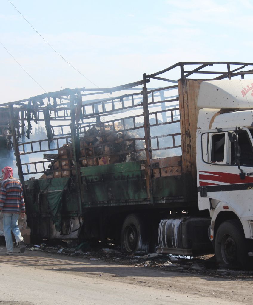 Wreckage of Syrian Red Crescent aid trucks after they were hit by airstrikes in Aleppo, Syria, on September 20. (Photo by Ahmad Hasan/Anadolu Agency/Getty Images)