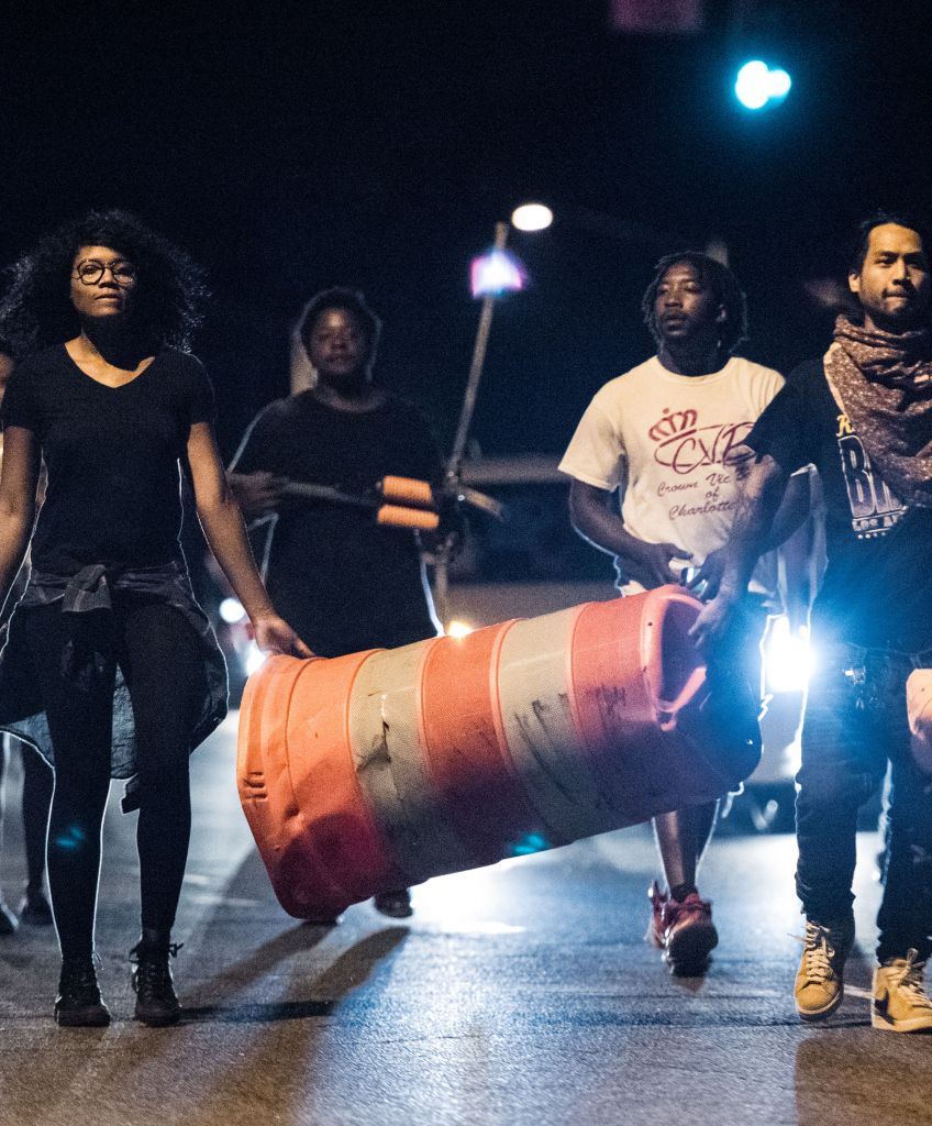 Protesters march after an officer-involved fatal shooting September 21, 2016, in Charlotte, NC. The protests began the previous night following the fatal shooting of 43-year-old Keith Lamont Scott at an apartment complex near UNC Charlotte. (Photo by Sean Rayford/Getty Images)