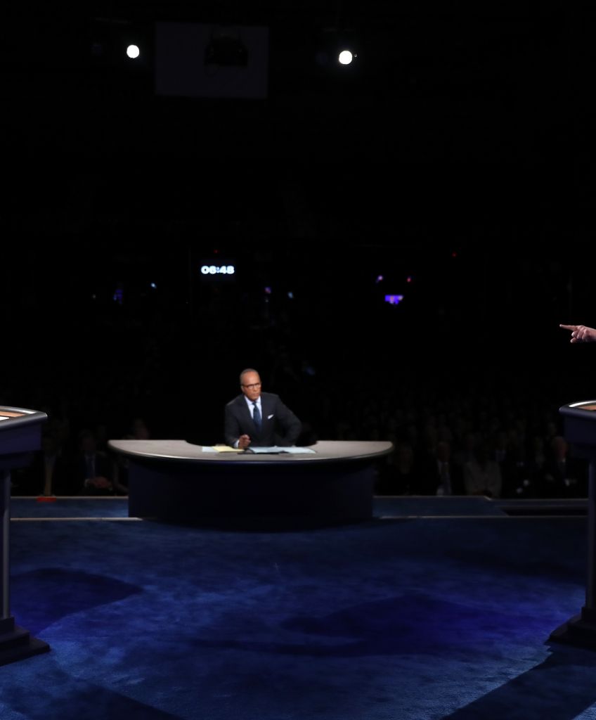 Donald Trump debates Hillary Clinton as moderator Lester Holt looks on during the presidential debate at Hofstra University on September 26, 2016 in Hempstead, New York. (Photo by Joe Raedle/Getty Images)