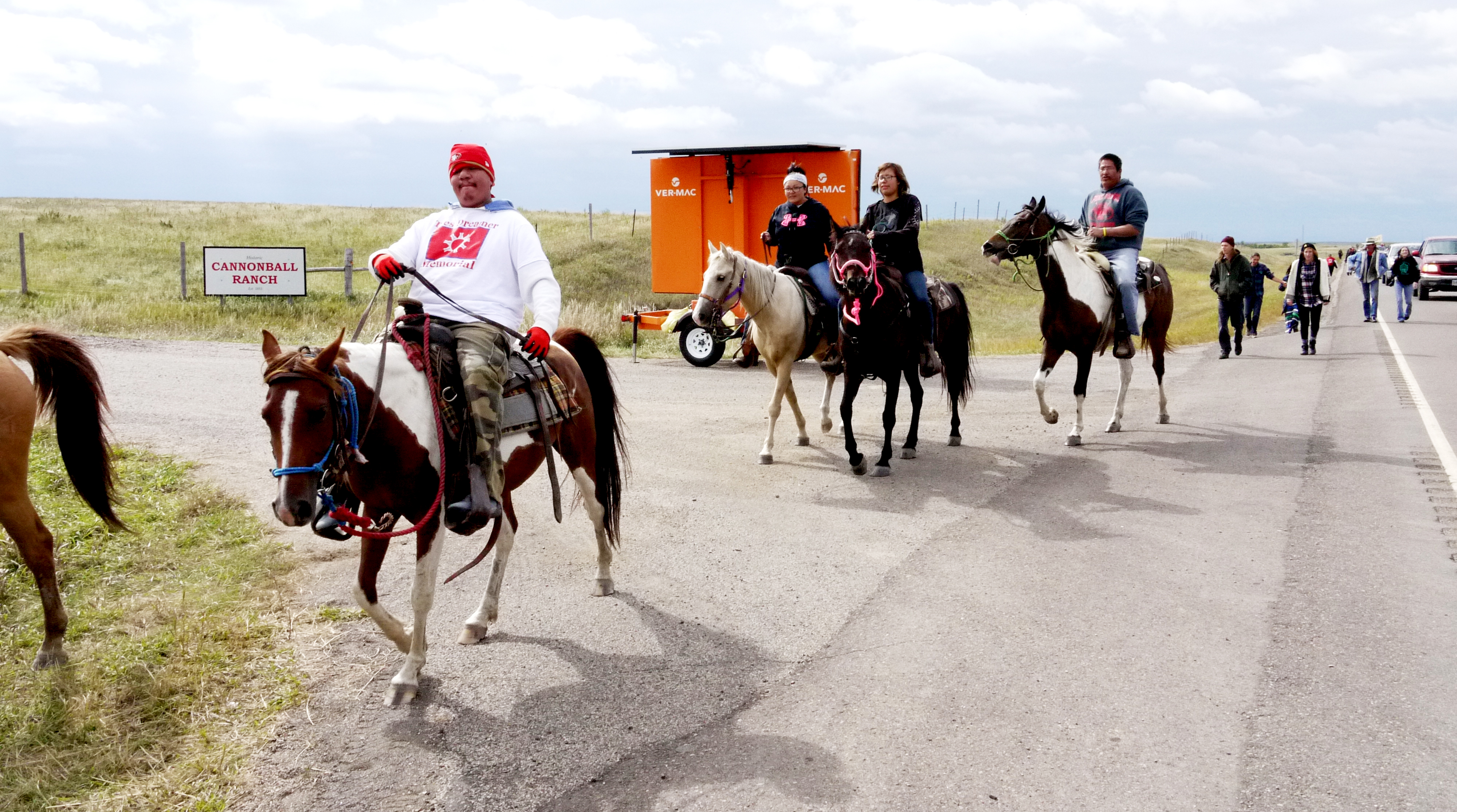 Horseback riders march from the Oceti Sakowin Camp to the Dakota Access Pipeline construction site, Sept. 13, 2016. (Sarah Jaffe for BillMoyers.com)