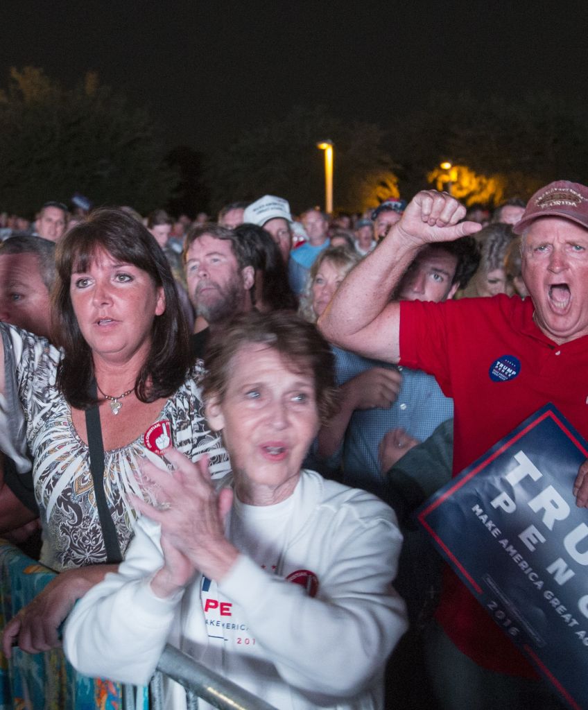 Supporters cheer Donald Trump during his rally at Pier Park Amphitheater on October 11, 2016 in Panama City Beach, Florida. (Photo by Mark Wallheiser/Getty Images)