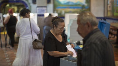 Latinos vote at a polling station in El Gallo Restaurant on Nov. 8, 2016 in the Boyle Heights section of Los Angeles, California. (Photo by David McNew/Getty Images)