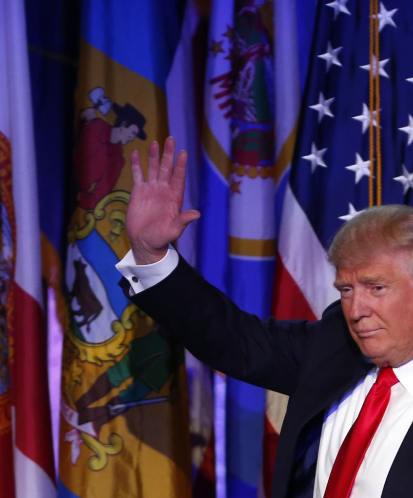 Donald Trump waves to the crowd after addressing his supporters and celebrating his presidential win at his election night event at the New York Hilton Midtown in New York City on Nov. 9, 2016. (Photo by Jessica Rinaldi/The Boston Globe via Getty Images)