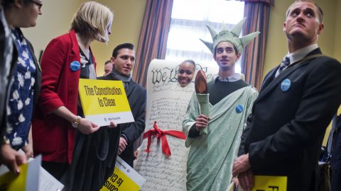 Kyle Epstein, dressed as the Statue of Liberty, and Corrina Qualls, dressed as the Constitution, along with members of Generation Progress, deliver VHS copies of Schoolhouse Rock to the office Sen. Jeff Sessions (R-AL) on March 3, 2016. The group, formerly known as Campus Progress, urged Senate Judiciary Committee members to allow a hearing for President Obama's nominee to the Supreme Court. (Photo By Tom Williams/CQ Roll Call)