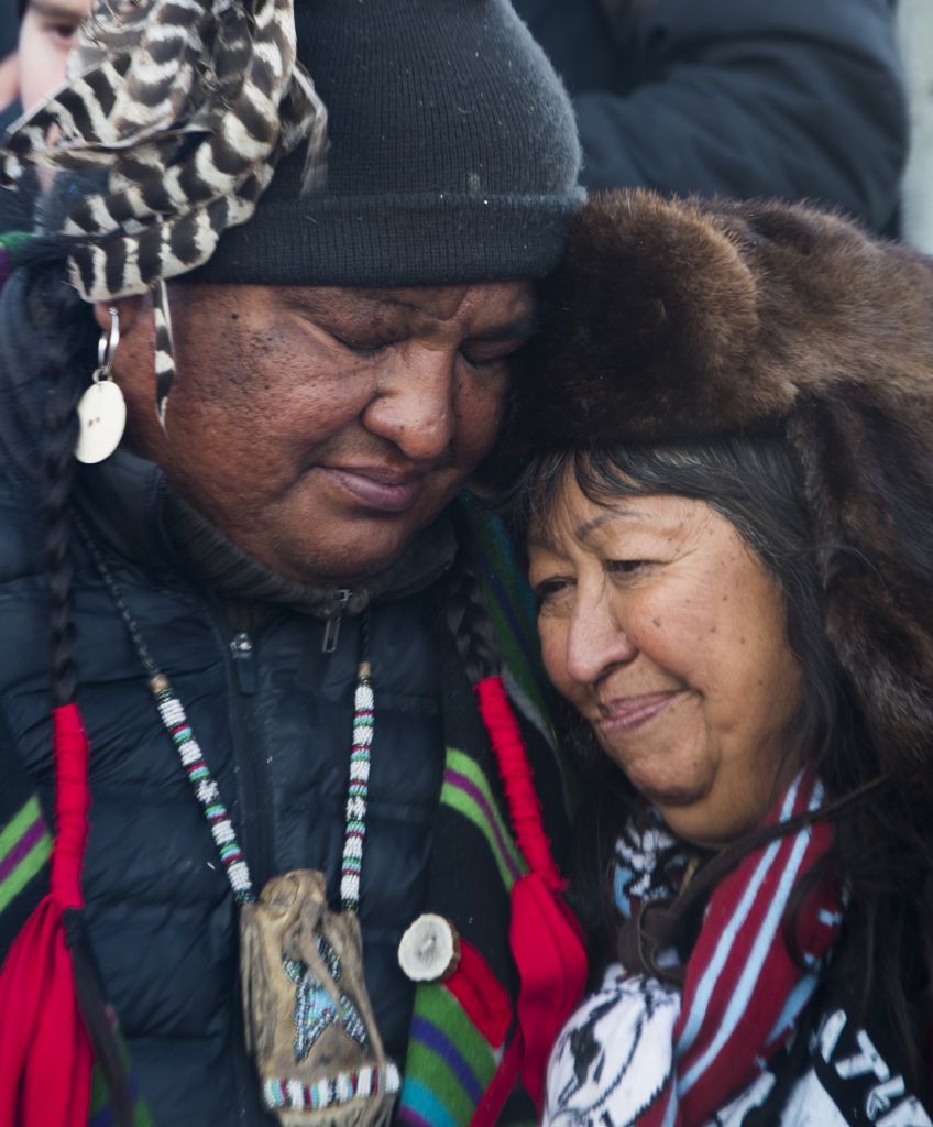 Activists celebrate at Oceti Sakowin Camp on the edge of the Standing Rock Sioux Reservation on December 4, 2016 outside Cannon Ball, North Dakota, after hearing that the Army Corps of Engineers has denied the current route for the Dakota Access pipeline. (JIM WATSON/AFP/Getty Images)