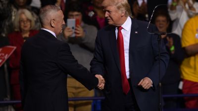 President-elect Donald Trump greets retired Marine Gen. James Mattis at the Crown Coliseum in Fayetteville, North Carolina on Dec. 6, 2016. (Photo by Timothy A. Clary/AFP/Getty Images)