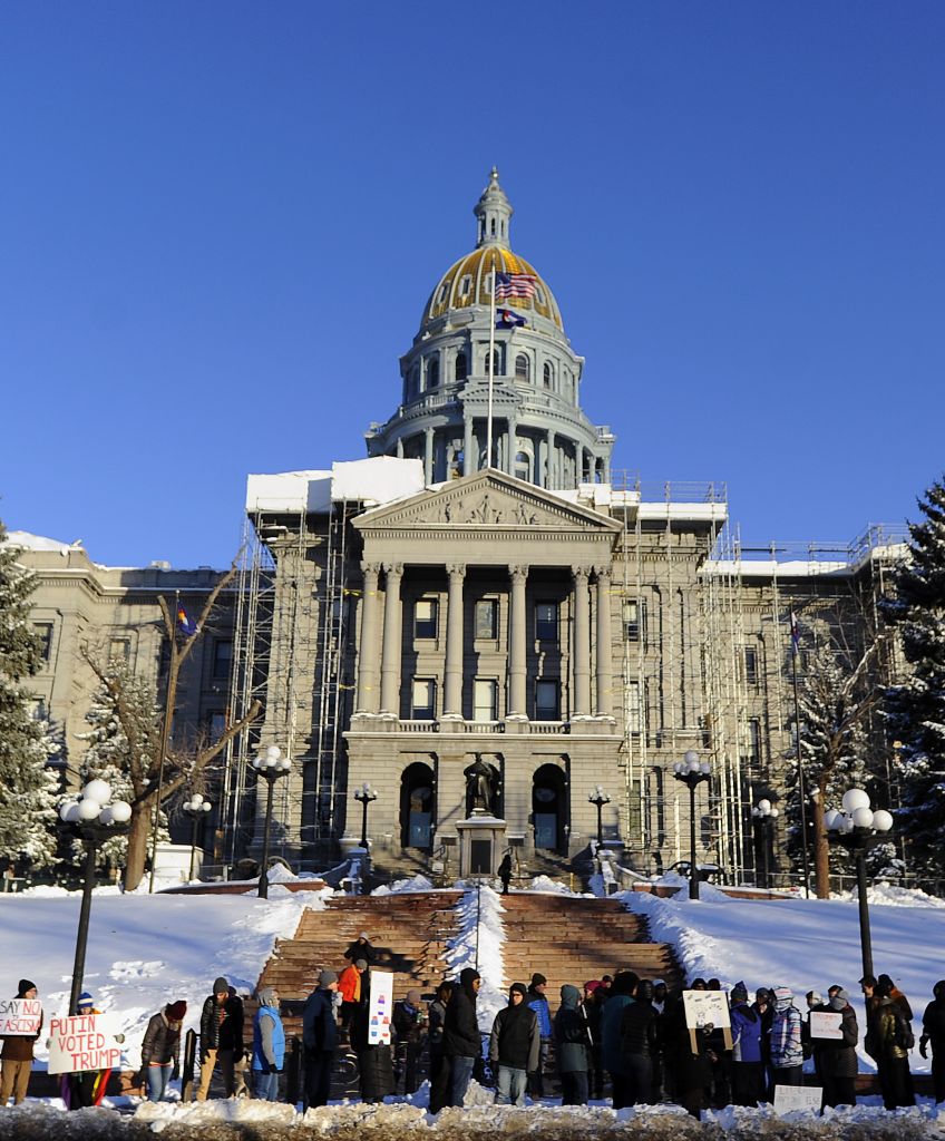 People demonstrate against President-elect Donald Trump on the eve of the Electoral College vote in Denver, Colorado on December 18, 2016. (CHRIS SCHNEIDER/AFP/Getty Images)