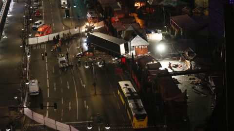 Forensic experts examine on December 20, 2016 the scene around a truck that crashed into a Christmas market near the Kaiser-Wilhelm-Gedaechtniskirche (Kaiser Wilhelm Memorial Church) in Berlin. (ODD ANDERSEN/AFP/Getty Images)