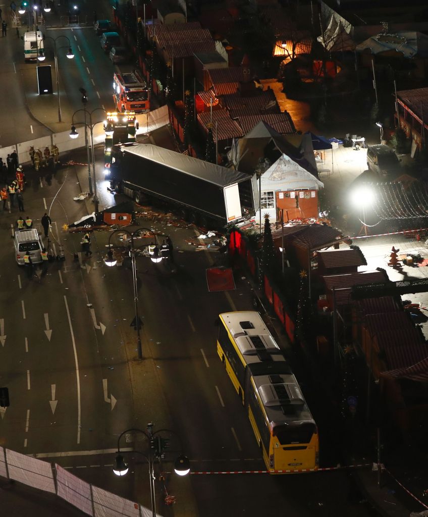 Forensic experts examine on December 20, 2016 the scene around a truck that crashed into a Christmas market near the Kaiser-Wilhelm-Gedaechtniskirche (Kaiser Wilhelm Memorial Church) in Berlin. (ODD ANDERSEN/AFP/Getty Images)