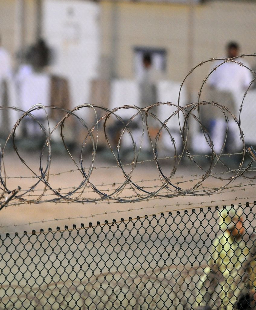 GUANTANAMO BAY, CUBA. A Navy guard assigned to Joint Task Force Guantanamo patrols Camp Delta. (JTF Guantanamo photo by U.S. Air Force Tech. Sgt. Michael R. Holzworth)