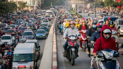 Motorbike drivers covered up with face masks try to get through the morning peak hour traffic at Nga Tu So intersection on Nov. 4, 2016 in Hanoi, Vietnam. (Photo by Linh Pham/Getty Images)