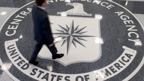 A man crosses the Central Intelligence Agency logo in the lobby of CIA headquarters in Langley, Virginia, on Aug. 14, 2008. (Photo by Saul Loeb/AFP/Getty Images)