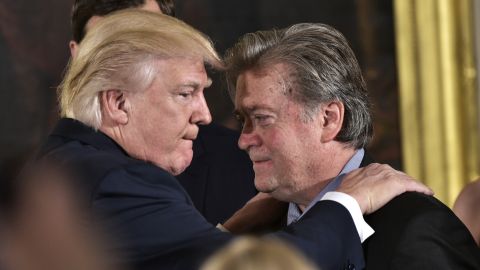 President Donald Trump congratulates senior counselor Stephen Bannon during the swearing-in of senior staff in the East Room of the White House on Jan. 22, 2017 in Washington, DC. (Photo by Mandel Ngan/AFP/Getty Images)