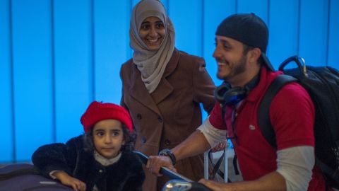 Yemenis Samar Alwahiri, Saleh Alambri, and daughter Laila Alambri, 3, who were among those stranded in Djibouti when President Trump ordered his travel ban, arrive at Los Angeles International Airport on February 8. (DAVID MCNEW/AFP/Getty Images)