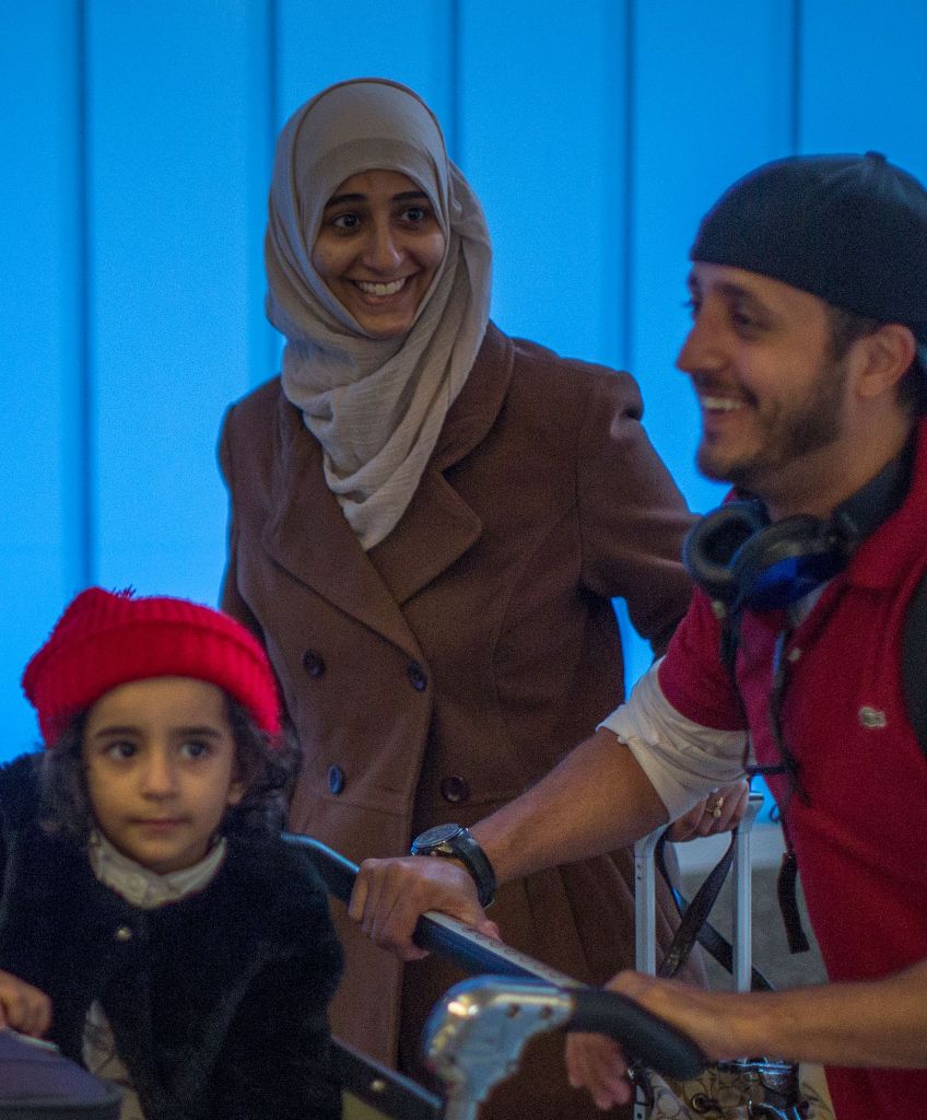 Yemenis Samar Alwahiri, Saleh Alambri, and daughter Laila Alambri, 3, who were among those stranded in Djibouti when President Trump ordered his travel ban, arrive at Los Angeles International Airport on February 8. (DAVID MCNEW/AFP/Getty Images)