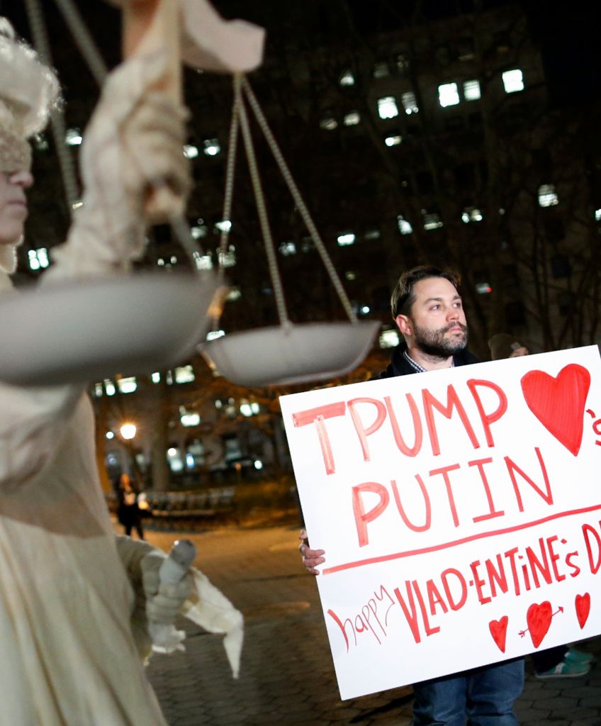 Demonstrators hold signs as the New York Immigration Coalition holds a rally in Foley Square in New York City on February 14, 2017. (EDUARDO MUNOZ ALVAREZ/AFP/Getty Images)