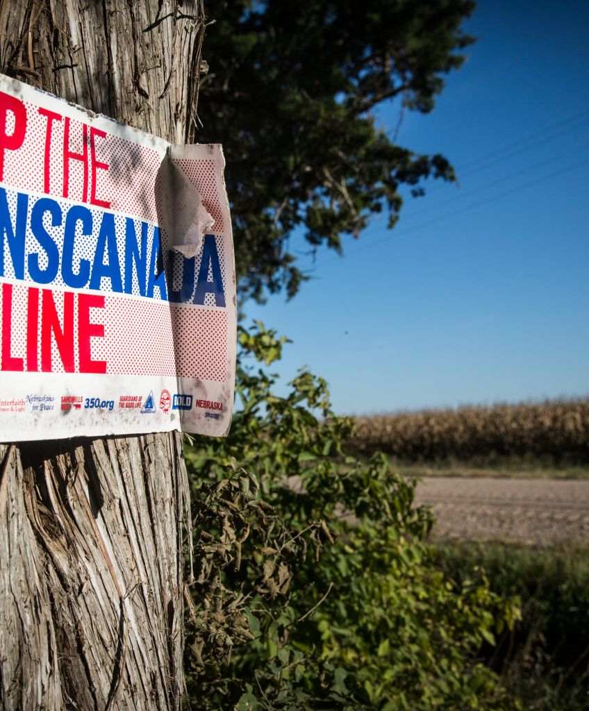 A sign against the proposed Keystone XL pipeline is posted to a tree in Polk, Nebraska, in 2014. Transcanada has been trying to find a route for the pipeline through Nebraska for eight years, but has faced pushback from landowners. (Photo by Andrew Burton/Getty Images)