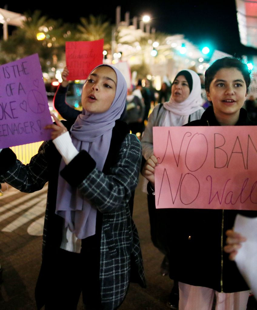 Protesters chant during a rally against the Trump travel ban at the San Diego International Airport on Monday, March 6, 2017. (Photo by Sandy Huffaker/AFP/Getty Images)