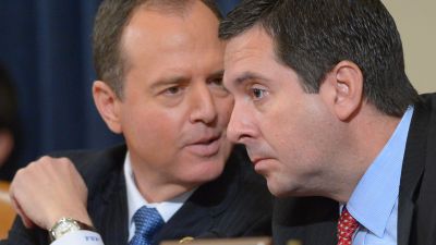 Ranking member Rep. Adam Schiff (D-CA) and chairman Rep. Devin Nunes (R-CA) confer during the first day of the House Permanent Select Committee on Intelligence hearing on Russian actions during the 2016 election campaign, March 20, 2017 on Capitol Hill in Washington, DC. (Photo by Mandel Ngan/AFP/Getty Images)