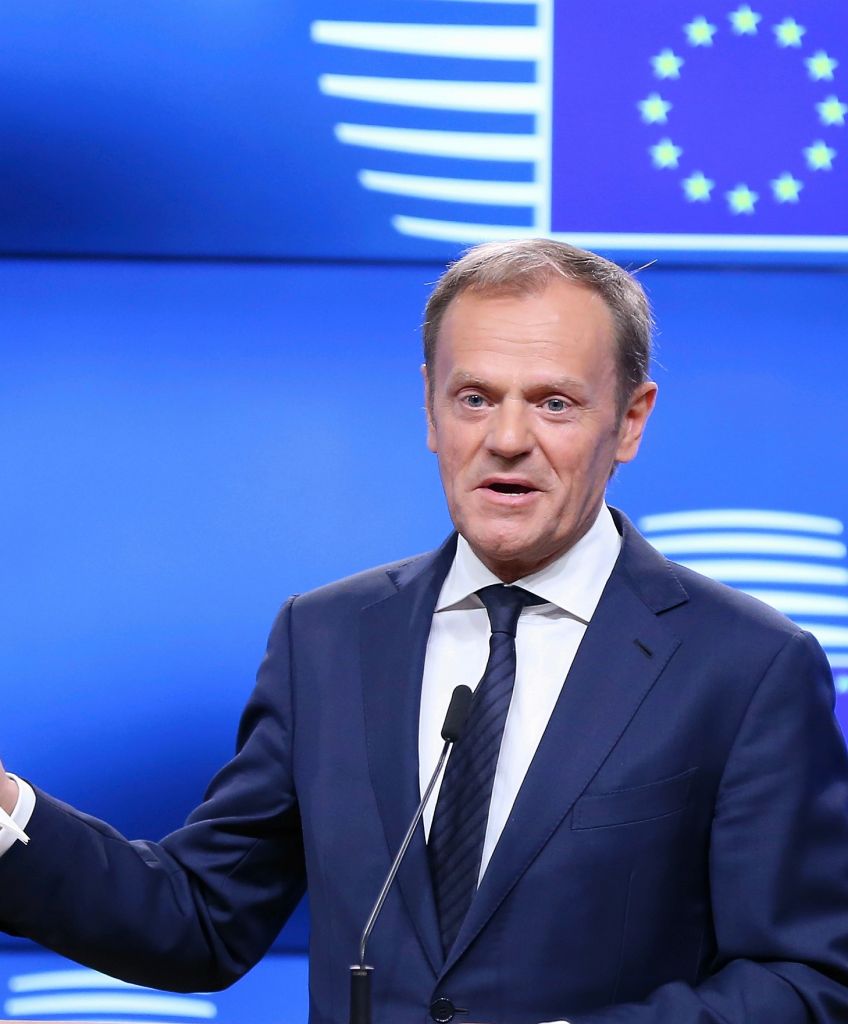 European Council President Donald Tusk shows British Prime Minister Theresa May's letter as he holds a press conference after his meeting with Britain's ambassador to the EU in Brussels on March 29, 2017. (Photo by Dursun Aydemir/Anadolu Agency/Getty Images)