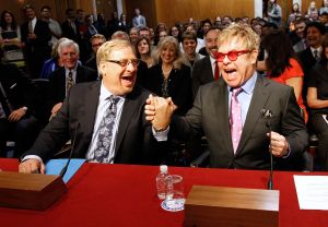Sir Elton John, founder of the Elton John Aids Foundation, and Pastor Rick Warren shake hands before testifying at a US Senate Appropriations State, Foreign Operations and Related Programs Subcommittee hearing on Global Health Programs to urge critical support in global fight against HIV/AIDS on May 6, 2015 in Washington, DC. (Photo by Paul Morigi/Getty Images for EJAF)