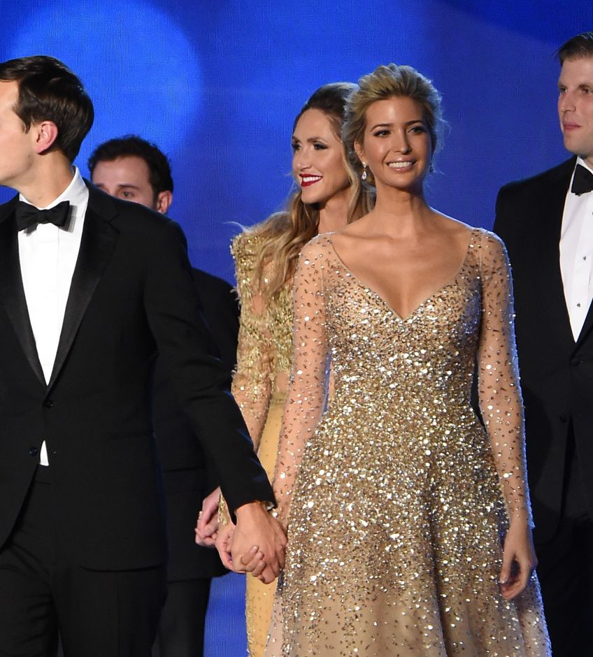 Ivanka Trump, her husband Jared Kushner (left) and brother Eric Trump (right) arrive at the Freedom Inaugural Ball in Washington, DC, on Jan. 20, 2017. (Photo by Robyn Beck/AFP/Getty Images)