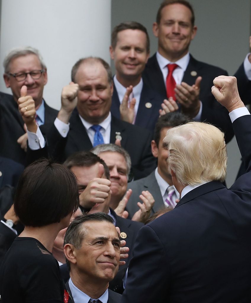 President Donald Trump congratulates House Republicans after they passed legislation aimed at repealing and replacing ObamaCare, during an event in the Rose Garden at the White House, on May 4, 2017 in Washington, DC. The House bill would still need to be passed by the Senate before it could be signed into law. (Photo by Mark Wilson/Getty Images)