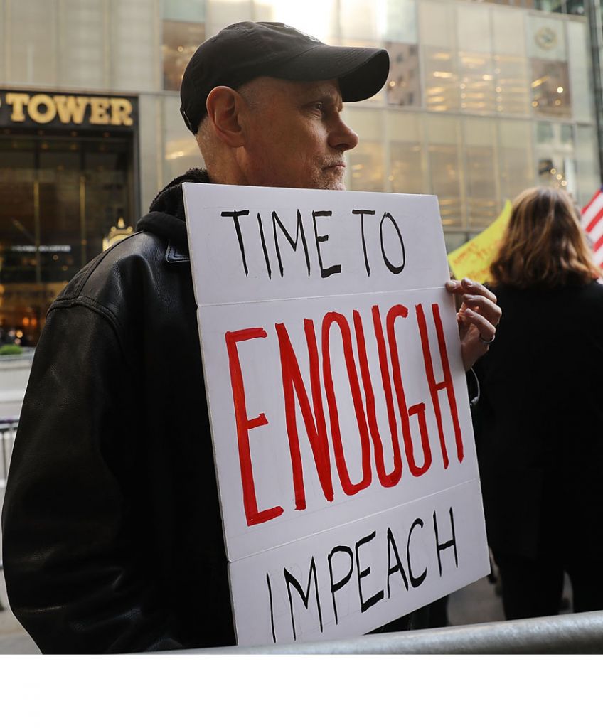 Protesters gather outside of Trump Tower a day after FBI Director James Comey was fired by President Donald Trump on May 10, 2017 in New York City. (Photo by Spencer Platt/Getty Images)