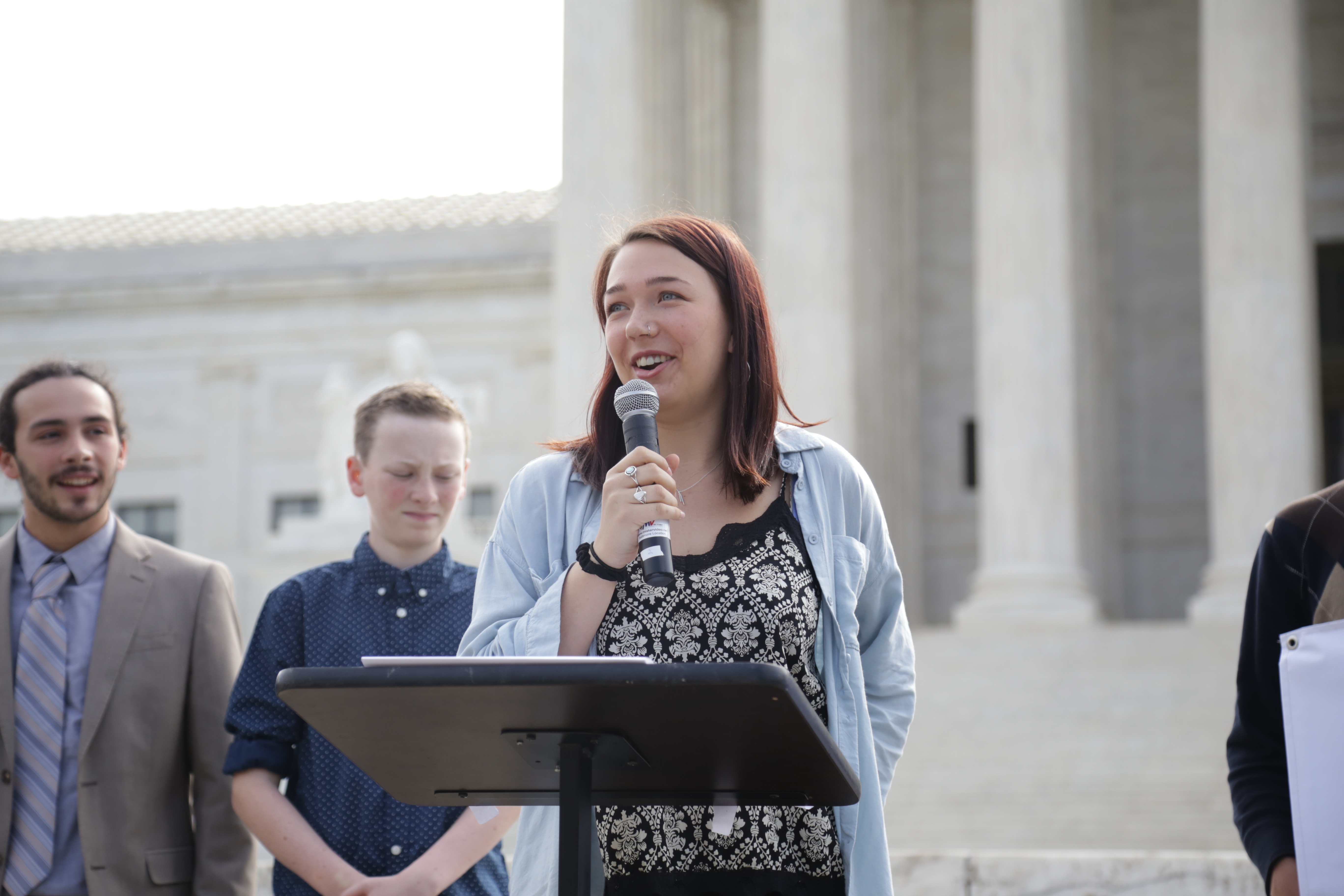 Lead plaintiff Kelsey Juliana (21) speaks in front of the Supreme Court on April 27, 2017. (Photo by John Light)