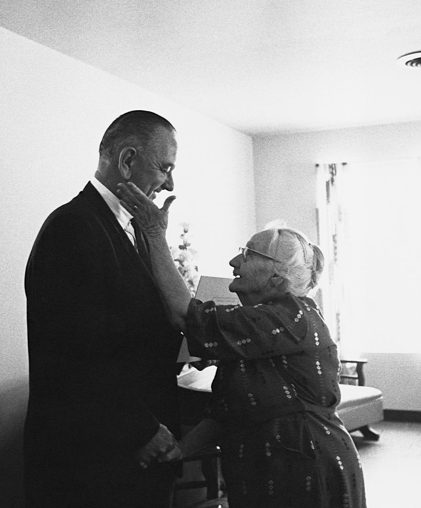 An elderly woman shows her gratitude to President Lyndon B. Johnson for his signing of the Medicare health care bill in July 1965. (Photo by © CORBIS/Corbis via Getty Images)