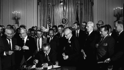 President Johnson signing the Civil Rights Act of 1964. (Photo courtesy of the National Archives and Records Administration)