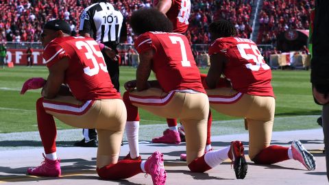 Eric Reid (#35), Colin Kaepernick (#7) and Eli Harold (#58) of the San Francisco 49ers kneel in protest during the national anthem prior to their NFL game against the Tampa Bay Buccaneers at Levi's Stadium on Oct. 23, 2016 in Santa Clara, California. (Photo by Thearon W. Henderson/Getty Images)