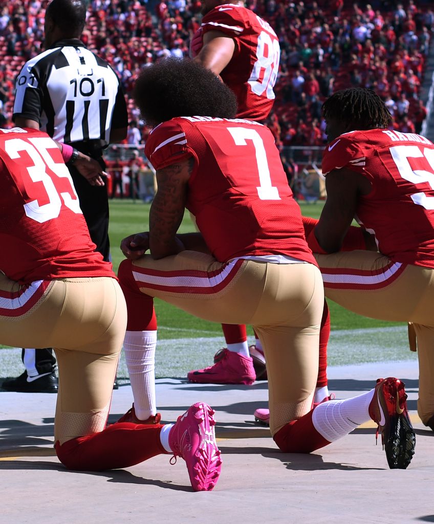 Eric Reid (#35), Colin Kaepernick (#7) and Eli Harold (#58) of the San Francisco 49ers kneel in protest during the national anthem prior to their NFL game against the Tampa Bay Buccaneers at Levi's Stadium on Oct. 23, 2016 in Santa Clara, California. (Photo by Thearon W. Henderson/Getty Images)