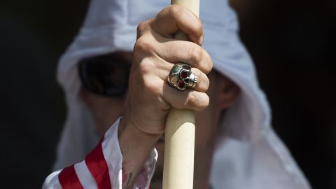 A member of the Ku Klux Klan during a rally calling for the protection of Southern Confederate monuments, in Charlottesville, Virginia on July 8, 2017. The rally was authorized by Virginia officials and stirred heated debate in America, where critics say the far right has been energized by Donald Trump's election to the presidency. (Photo by Andrew Caballero-Reynolds/AFP/Getty Images)