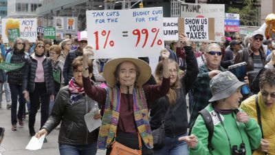 New Yorkers and visiting demonstrators protest during a march on Tax Day demanding that President Donald Trump release his tax returns in New York City on April 15, 2017. (Photo via EuropaNewswire/Gado/Getty Images)