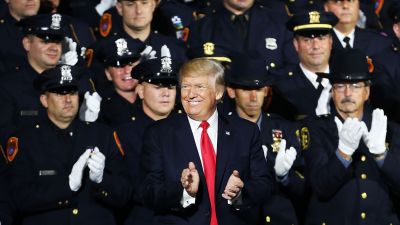 President Donald Trump speaks at Suffolk Community College on July 28, 2017 in Brentwood, New York. Trump, speaking close to where the violent street gang MS-13 has committed a number of murders, urged Congress to dedicate more funding to border enforcement and faster deportations. Trump spoke to an audience that included to law enforcement officers and the family members of crime victims. (Photo by Spencer Platt/Getty Images)