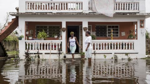 Residents wade through flood waters at their home days after Hurricane Maria made landfall, on Sept. 22, 2017 in Loiza, Puerto Rico. Many on the island have lost power, running water and cell phone service after Hurricane Maria, a category 4 hurricane, passed through. (Photo by Alex Wroblewski/Getty Images)