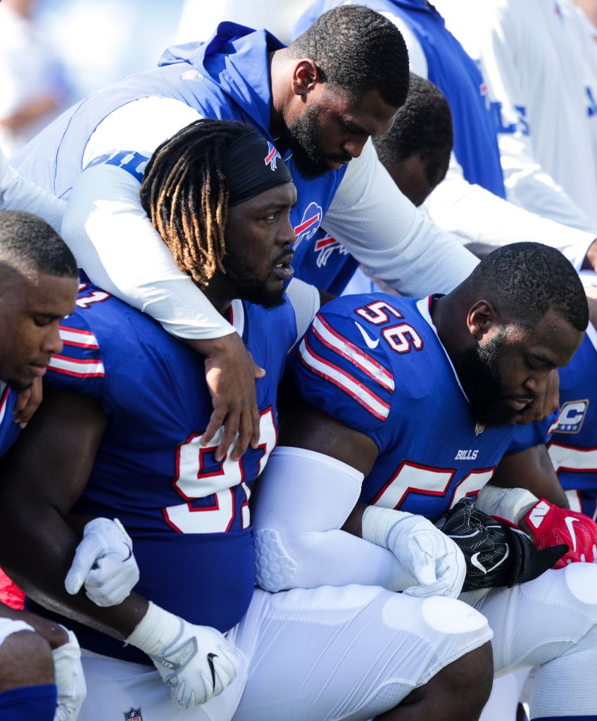 Buffalo Bills players kneel during the national anthem before an NFL game against the Denver Broncos on Sept. 24, 2017 at New Era Field in Orchard Park, New York. (Photo by Brett Carlsen/Getty Images)